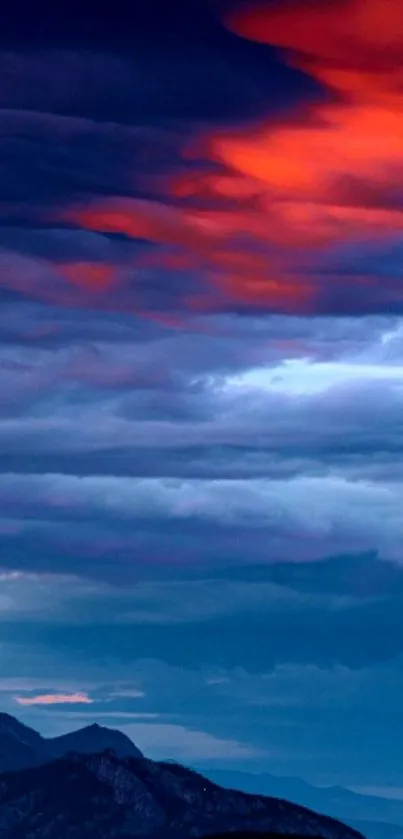 Dramatic sky with mountains and sunset clouds.