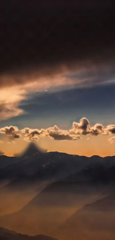 Dramatic sunset over misty mountains with vivid clouds.