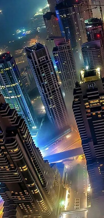 Aerial nighttime cityscape with illuminated skyscrapers and vibrant lights.