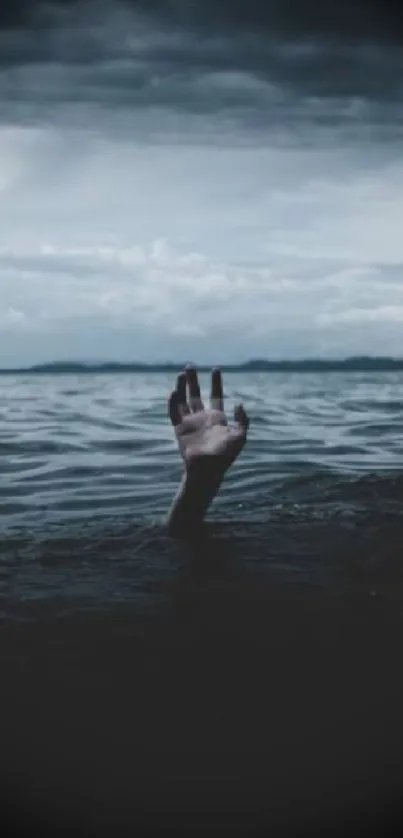 A hand emerging from the stormy ocean under a dramatic dark sky.