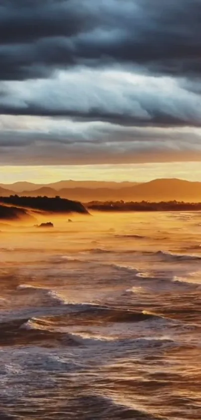 Stunning view of an ocean sunrise with fiery orange and cool blue clouds.