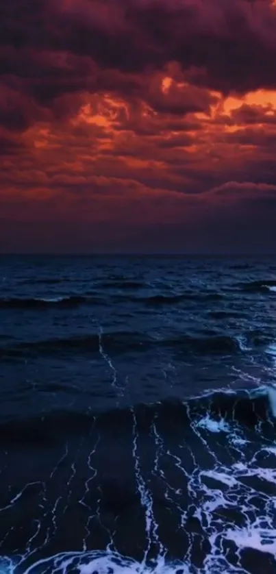 Dramatic ocean under a vibrant purple and orange sunset sky.