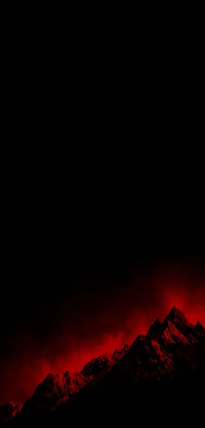 Dramatic red-lit mountain under a dark night sky.