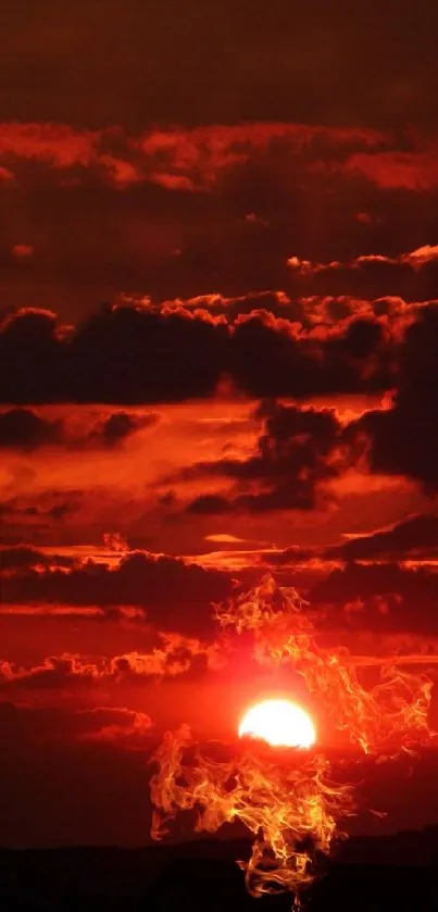 Fiery red sunset with dramatic clouds and horizon view.