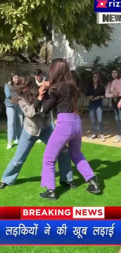 Young people in playful scene on green grass.