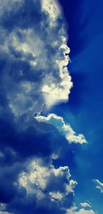 Dramatic blue sky with vibrant clouds wallpaper.