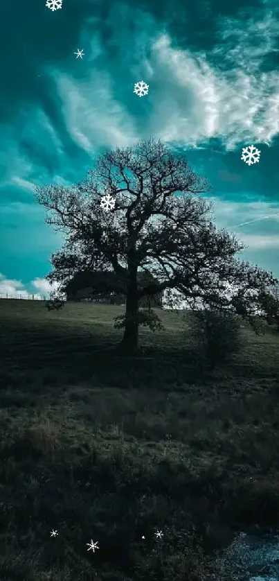 Silhouetted tree and blue sky in landscape wallpaper.