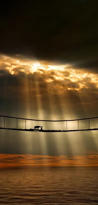 Bridge with golden sunset and dramatic clouds over ocean.