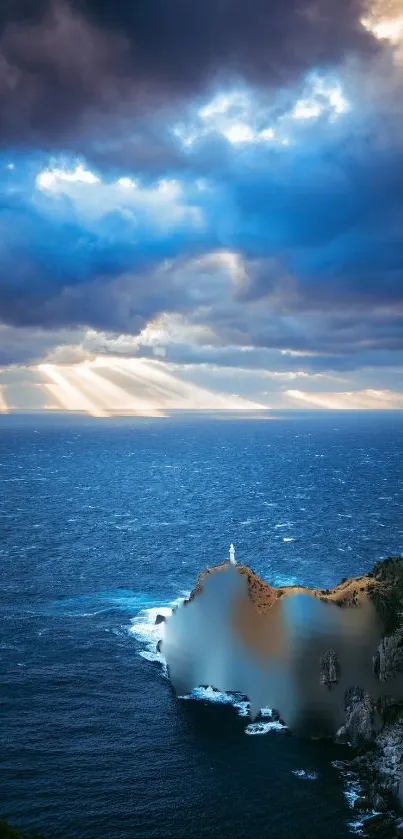 Dramatic sky with sun rays over ocean and lighthouse viewed from cliff.