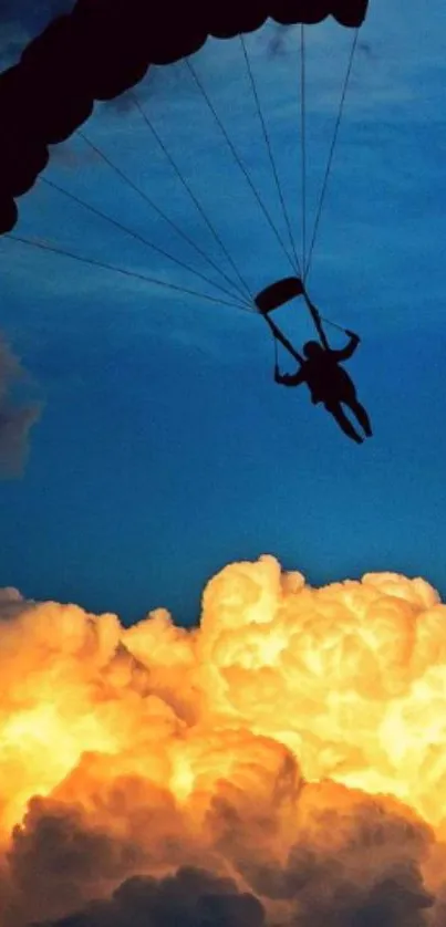 Silhouette of a parachutist against a vibrant orange clouded sky.