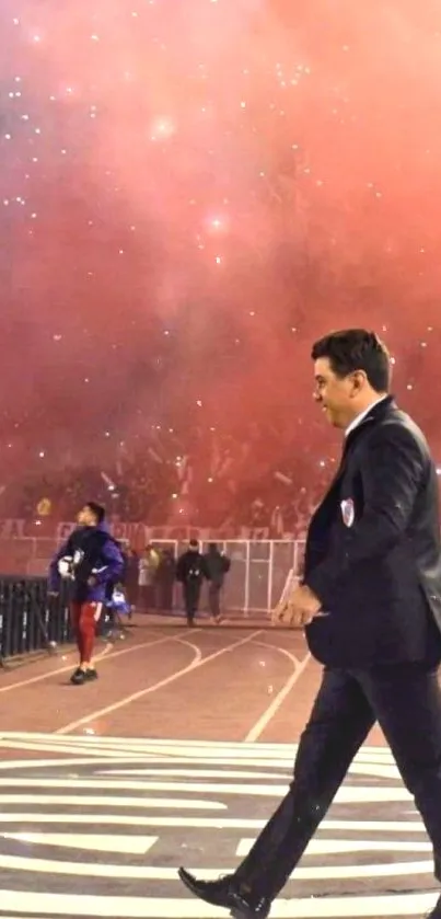 Man walking in stadium with red smoke.