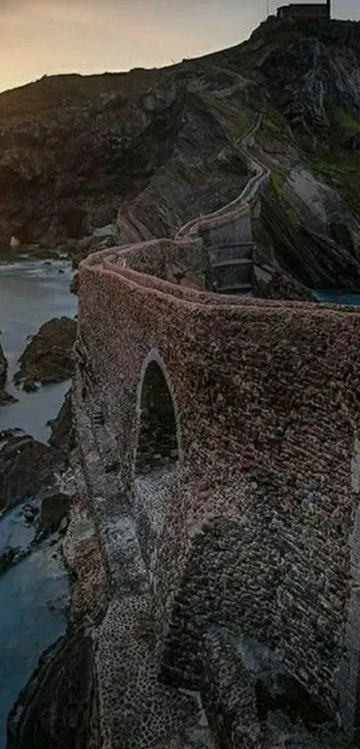 Dramatic stone pathway leading to hilltop at sunset.