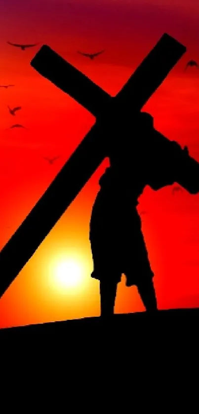 Silhouette of a figure carrying a cross at sunset with red and orange sky.