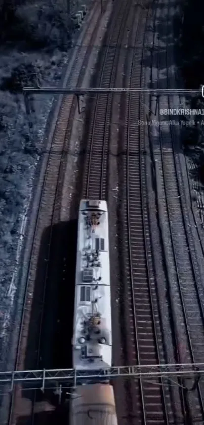 Aerial view of railway tracks with a train moving.