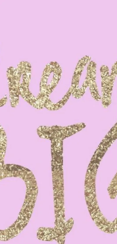 Glittery gold 'Dream Big' text on pastel pink wallpaper.