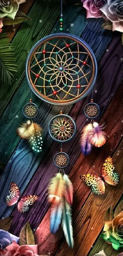 Dreamcatcher with colorful butterflies and roses on a wooden background.