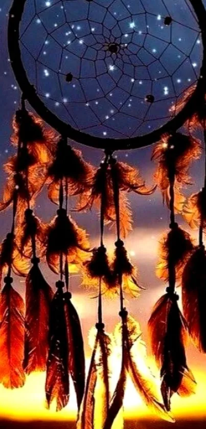 Dreamcatcher silhouette against a sunset sky with stars and glowing feathers.