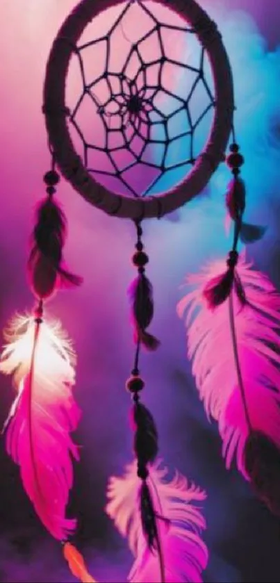 A vibrant dreamcatcher with neon pink and blue feathers hanging elegantly.