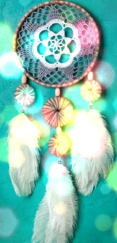 Handmade dreamcatcher with teal feathers on a teal textured background.