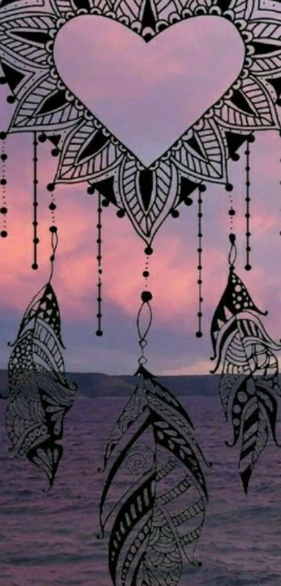 Intricate dreamcatcher over pink sunset sky wallpaper.