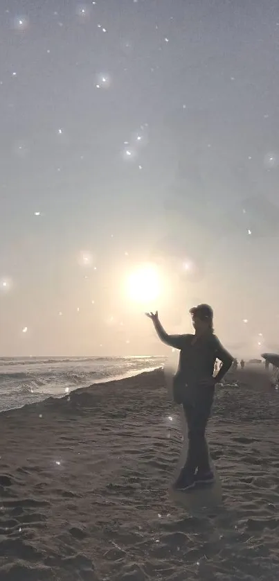 Silhouette on beach during a magical sunset with twinkling stars.