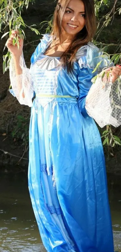 Woman in a blue dress amidst nature.