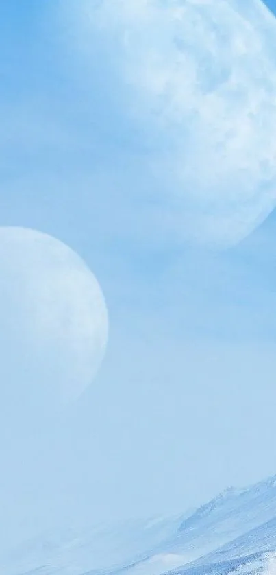 Surreal twin moons in a snowy landscape under a blue sky.