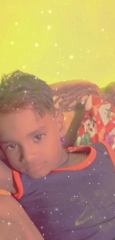 Child resting with a glowing starry effect on yellow background.