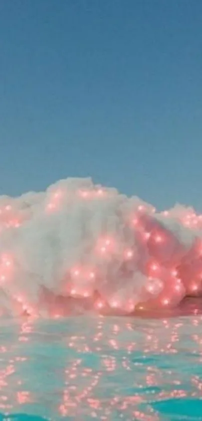 Dreamy cloud with pink lights over blue water.