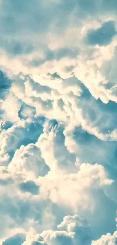 Dreamy cloudscape wallpaper with blue hues.