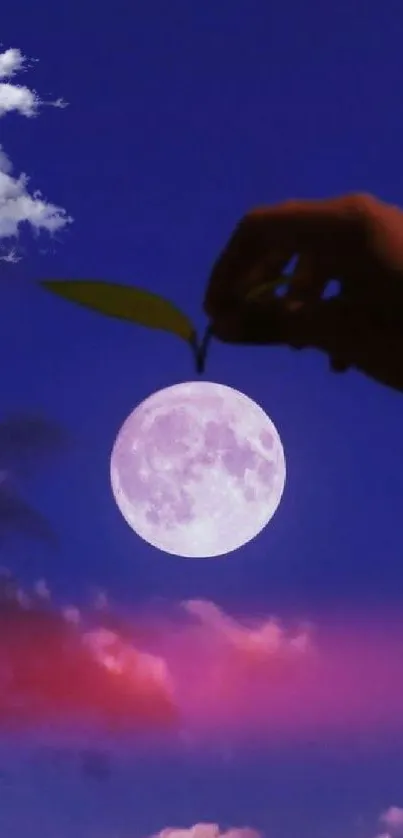 Hand holding a moon with a dreamy twilight sky backdrop.