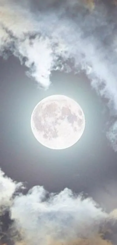 A dreamy full moon surrounded by soft clouds in a serene night sky.