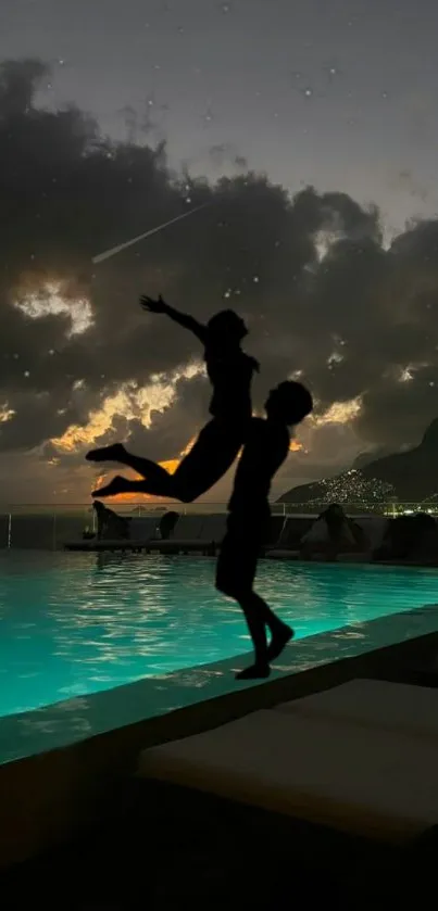 Silhouette at night by the pool against a starry sky and glowing clouds.