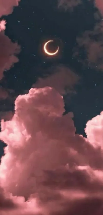 Pink clouds and crescent moon at night.