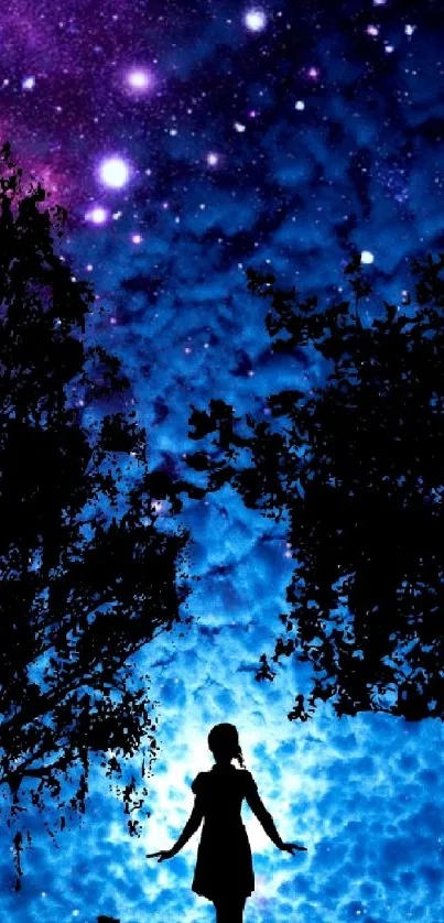 Silhouette under a starry night sky with vibrant cosmic colors.