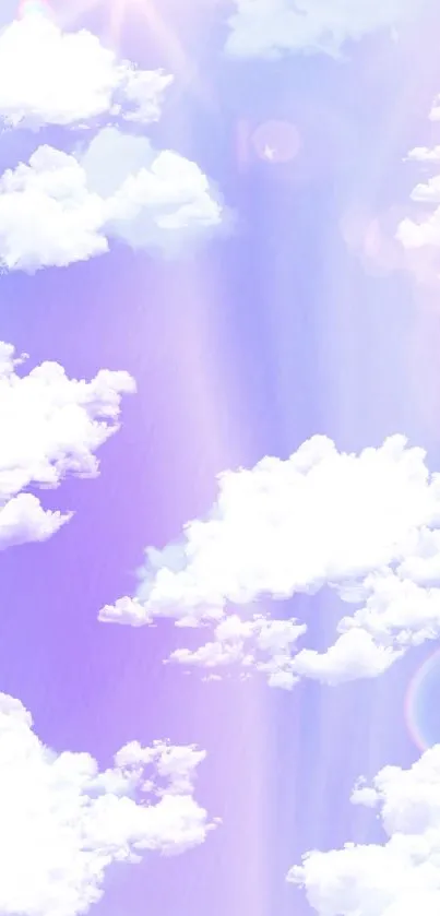 Dreamy pastel clouds on a purple sky background wallpaper.