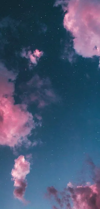 Dreamy pink clouds and night sky with stars.