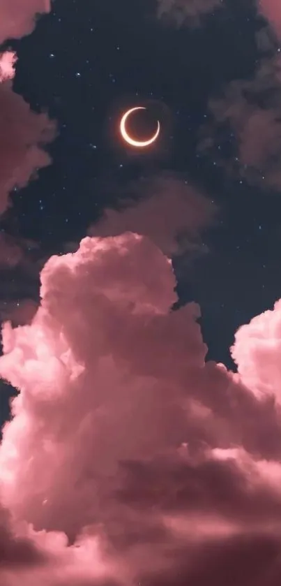 Pink clouds with crescent moon over night sky.