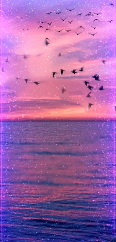 Dreamy ocean sunset with pink sky and flying birds.