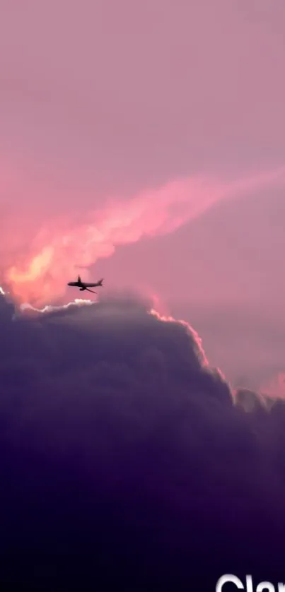 An airplane silhouette against purple-pink clouds with a dreamy sky backdrop.