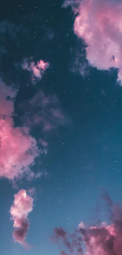 Dreamy pink clouds and night sky with stars.