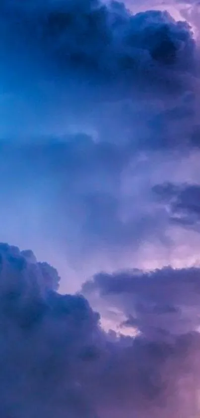 Purple and blue clouds in a dreamy sky wallpaper.