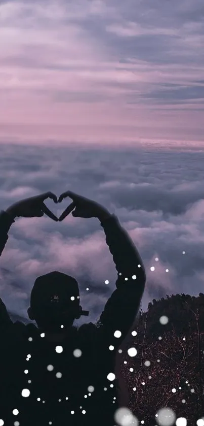 Silhouette forming heart shape with misty lavender clouds.