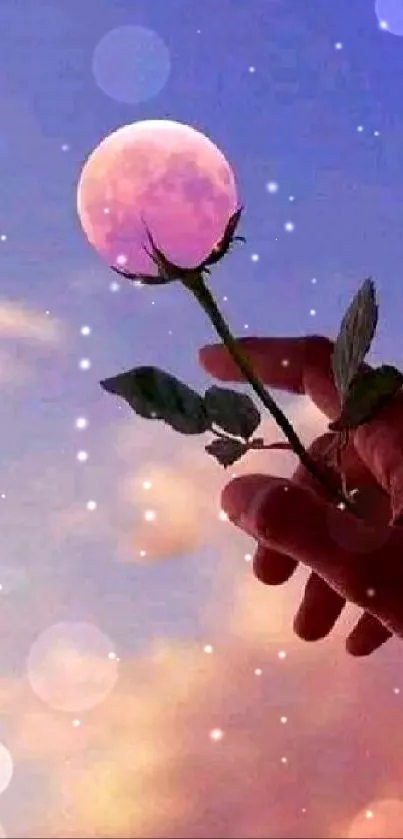 Hand holding a rose against a dreamy purple sunset sky.