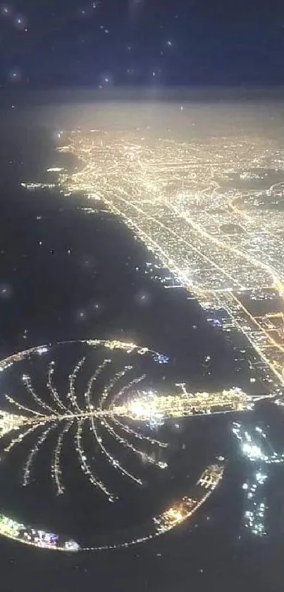 Aerial view of Dubai's lit skyline at night with Palm Jumeirah.