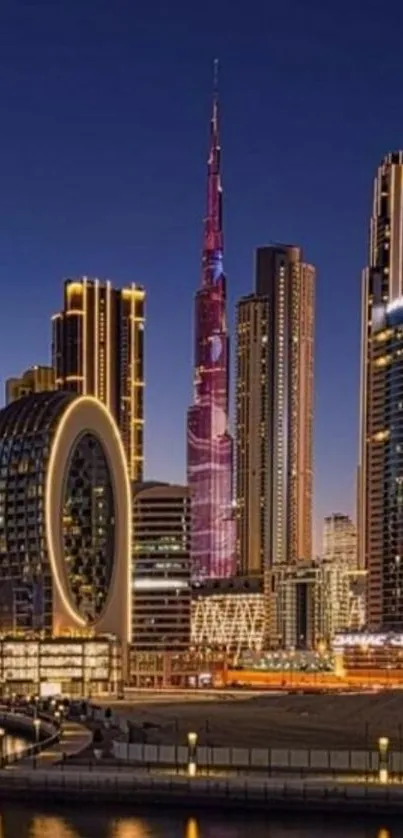 Dubai skyline at night with illuminated skyscrapers and reflections.