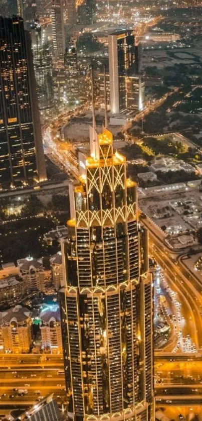 Aerial view of Dubai skyline at night with illuminated skyscrapers.