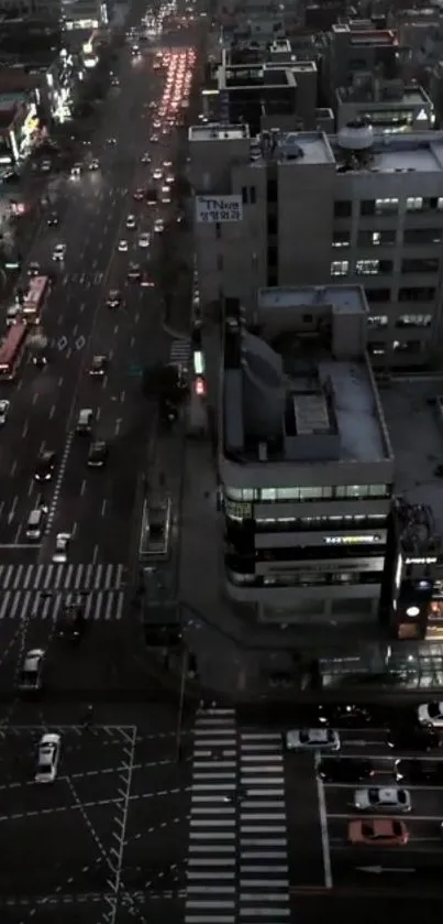 Aerial view of a city street bustling with traffic at dusk.