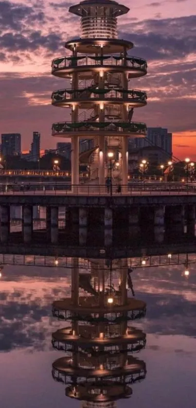 Tower with reflection during purple dusk with city lights.