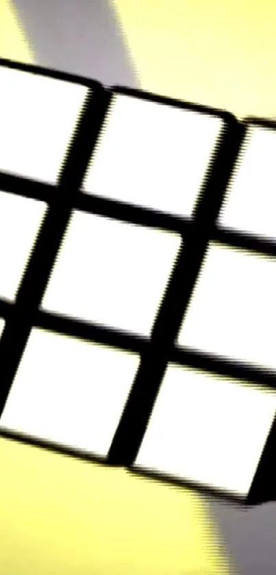 Abstract cube on vibrant yellow background.